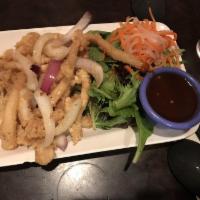 Fried Calamari · Lightly breaded fresh squid fried with garlic and butter served with mixed green.