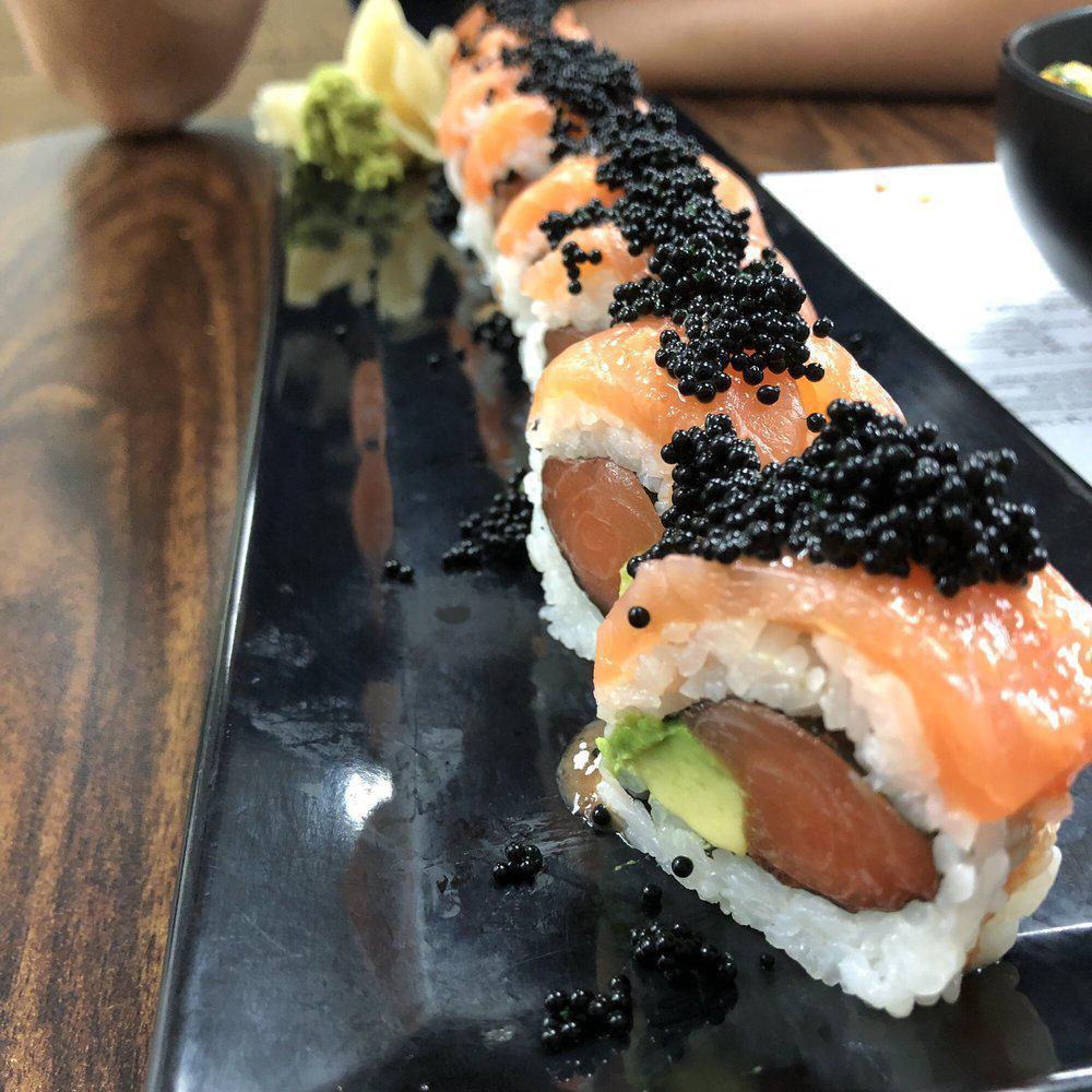 Passion Salmon Roll · 8 pieces. Salmon, avocado top with salmon and tobiko with creamy poke sauce.