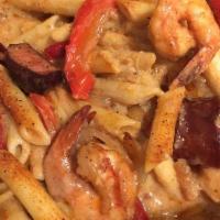 Cajun Shrimp Pasta · Sautee with savory red and green bell peppers, onions, kielbasa pork sausages, Monterey jack...