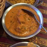 Chicken Korma · Boneless chicken cooked with onion, tomatoes, chashew nuts, raisin, spices and rich creamy s...