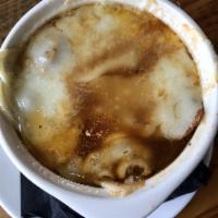 French Onion Soup · House made slow cooked veal stock, brandy, red wine, brioche crouton, gruyere cheese