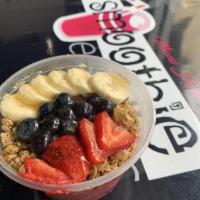 Acai Bowl · Acai fruit blend, topped with banana, granola, fresh strawberries, blueberries, agave, and c...