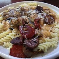New Orleans Pasta · Cajun grilled chicken, shrimp, andouille sausage, roasted red peppers and onions served over...