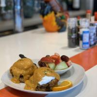Spicy Crab Cake Benedict · Meaty, crab cakes and topped with our spicy Hollandaise sauce. Spicy.