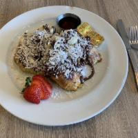 Southbay Style Croissant French Toast · Croissant French Toast topped with bananas, nutella, toasted coconut and whipped cream