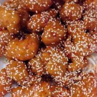 Sesame Chicken · Fried chicken tossed in sweet and spicy sesame sauce. Served with choice of rice. Hot and sp...
