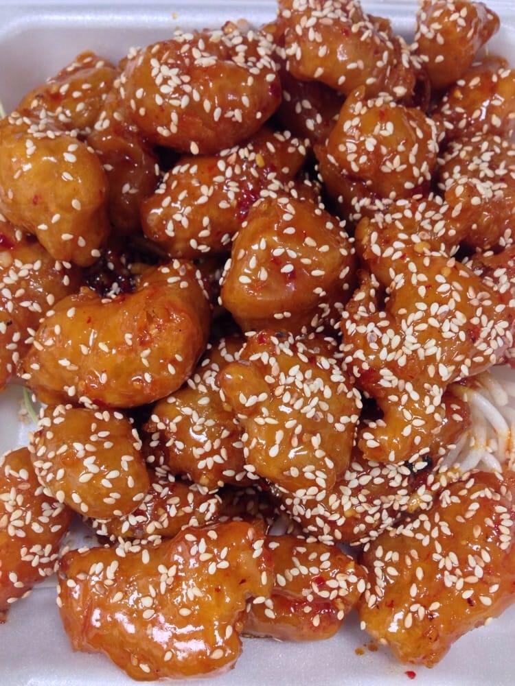 Sesame Chicken · Fried chicken tossed in sweet and spicy sesame sauce. Served with choice of rice. Hot and spicy.