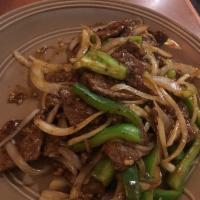 Mongolian Beef · Beef stir-fried with red and green bell peppers and yellow mustard. Served with choice of ri...