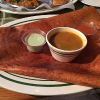Mysore Masala Dosai · Crepe coated with spicy sauce and with potato masala. Made with rice flour, lentils and semo...