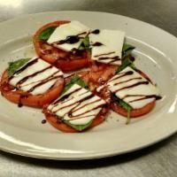 Caprese Salad · Tomatoes, fresh mozzarella cheese, basil, olive oil and balsamic reduction. Served with fres...