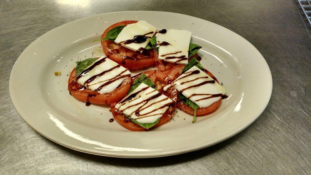Caprese Salad · Tomatoes, fresh mozzarella cheese, basil, olive oil and balsamic reduction. Served with fresh bread.
