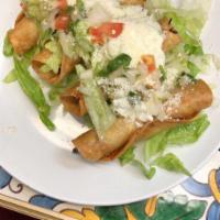 Flautas · 3 crispy corn tortillas stuffed with chicken, onions and cilantro, served with avocado sauce...