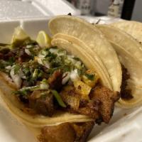 3 Tacos · 3 soft corn tortillas comes with onions, cilantro, served with yellow rice and black beans w...