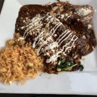Enchiladas · Three corn tortillas with choice of filling and sauce; topped with cheese and sour cream. Se...