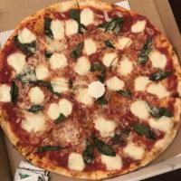 Margherita Pizza · Fresh mozzarella cheese, basil, extra virgin olive oil and tomato sauce.