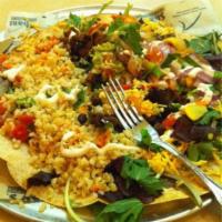 Tostada Salad · Organic greens, grilled veggies, organic rice, organic beans, cheese, cabbage, carrots, toma...