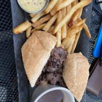 French Dip Sandwich · Roast beef, au jus, grilled hearth-baked French roll. Add cheese, mushrooms or caramelized o...