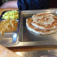 Parotta · Delicious south Indian fluffy bread served with veg curry and potato masala.