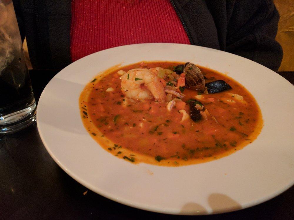 Seafood Farro · White fish, calamari, clams, shrimp, mussels, scallops, jalapenos, tomato garlic broth.