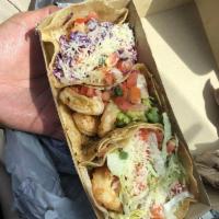 Baja Shrimp Taco · Fried tempura battered shrimp, baja sauce, purple cabbage, fresco cheese, and pico on a corn...