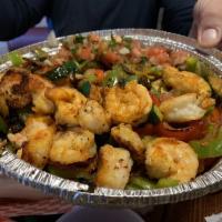Grilled Shrimp Bowl · Grilled shrimp on top of grilled veggies, black beans and pico de gallo.