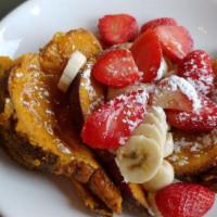 Captain Crunch French Toast · Encrusted with Captain Crunch cereal; bananas, strawberries, honey.