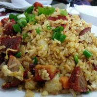 Pork Fried Rice · Fried Rice stir fried with BBQ Pork, peas, carrots, brown and green onions