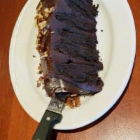Chocolate Motherlode Cake · Six decadent layers of chocolate cake and rich fudge icing, topped with walnuts. Featured on...