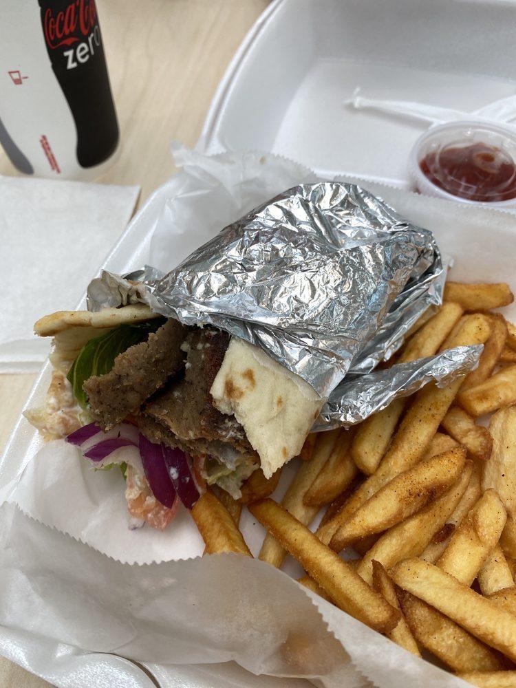 Gyro Wrap · Rotisserie cut beef and lamb gyro meat, lettuce, tomatoes, red onions and of course our delicious secret recipe tzatziki sauce.