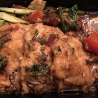 Chicken Marsala · Pan-seared chicken with mixed mushrooms in a Marsala demi sauce served with seasonal vegetab...