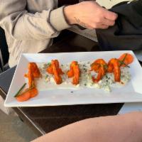 Buffalo Shrimp · Bleu cheese crumbles, pickled carrots, and bleu cheese dressing

