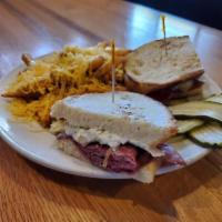 Reuben · Corned beef, sauerkraut, Swiss, and Thousand Island dressing on grilled rye bread. Recommend...