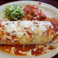 California Burrito · Large flour tortilla overstuffed with ground beef, seasoned shredded chicken, Mexican rice, ...