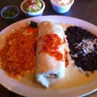Burrito Maria · Filled with spinach, cheese, grilled chicken and a touch of garlic topped with our special w...