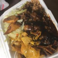 Oxtails & Curry Goat Combo · 