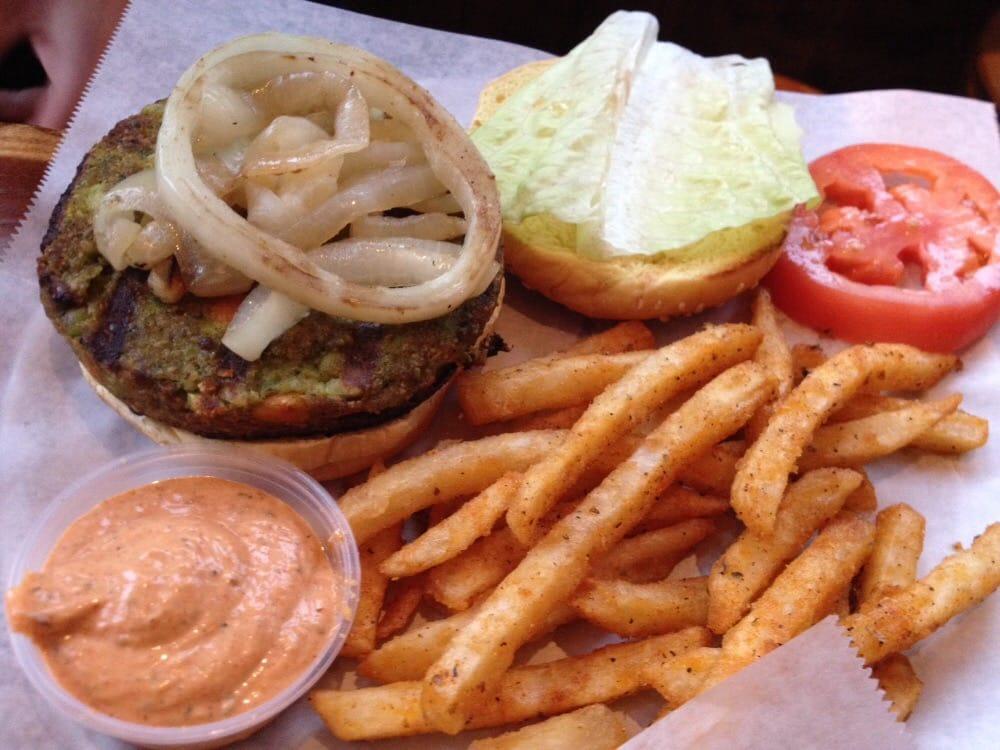 Veggie Burger · Special blend of grains and vegetables, grilled onions, tomato, lettuce and balsamic aioli. Served with choice of side.
