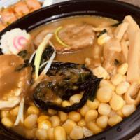 Japanese Curry Ramen · Japanese Curry flavored 
2 slices of pork belly, half a soft-boiled egg, 2 slices of fish ca...