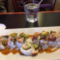Dragon Roll · Shrimp tempura, cucumber, crab. Out: avocado, BBQ eel, unagi sauce.