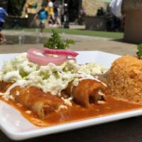Enchiladas · Stuffed with chicken or cheese, choice of a delicious homemade sauce, sour cream and cheese,...