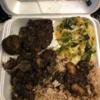 Oxtail · Served with rice and beans or white rice and cabbage.