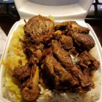 Brown Stew Chicken · Served with rice and beans or white rice or cabbage.