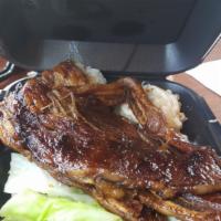 Kalbi Short Ribs · Tender beef short ribs marinated in Korean Style BBQ sauce, then grilled to perfection.