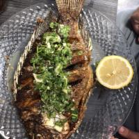 Tilapia · Whole fish, head and tail, fried with cilantro garlic and lime salsa. All fish are available...