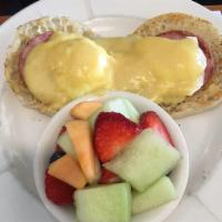 Eggs Benedict · Poached eggs and Canadian bacon on an English muffin, topped with hollandaise sauce. Served ...