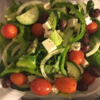 Greek Salad · Tomatoes, onions, green peppers, cucumbers, feta cheese, Kalamata olives and oregano on roma...