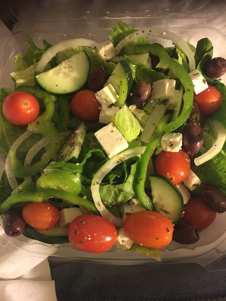 Greek Salad · Tomatoes, onions, green peppers, cucumbers, feta cheese, Kalamata olives and oregano on romaine lettuce.