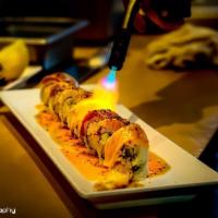 Dookie Roll · In shrimp tempura, cucumber, avocado, and spicy crab. Out salmon, tuna, albacore, and escola...