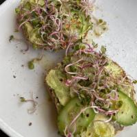 Avocado Toast · 2 Pcs Toasted multigrain bread, mashed avocado, cucumber, sprouts, and crushed red pepper.