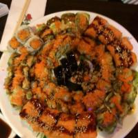6 Piece Godzilla Roll · Tempura spicy tuna, avocado on top with masago, scallion and chef's special sauce.