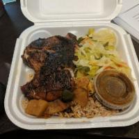 Jerk Chicken · Marinated overnight and grilled outdoors. Served with rice and peas and choice of side.